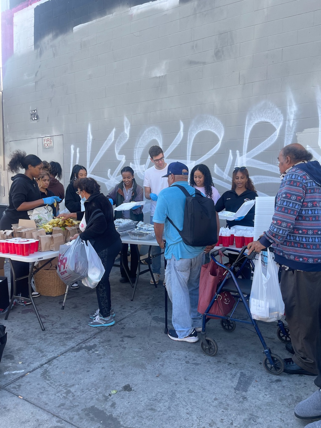 PACK Project volunteers serving food