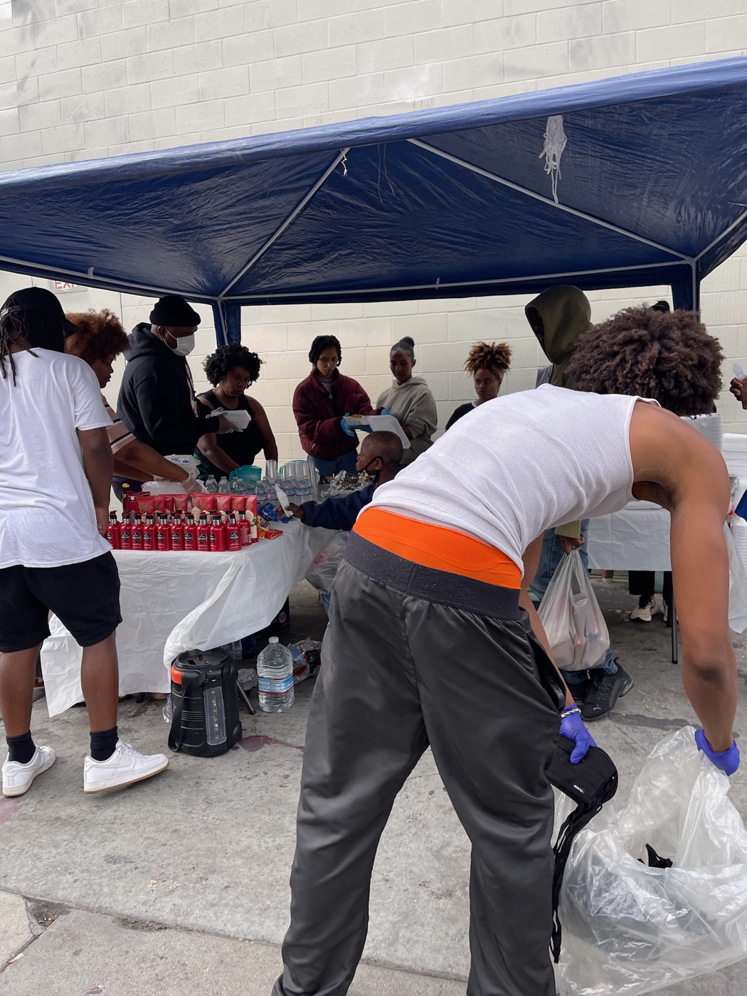 PACK Project team at a giveback event