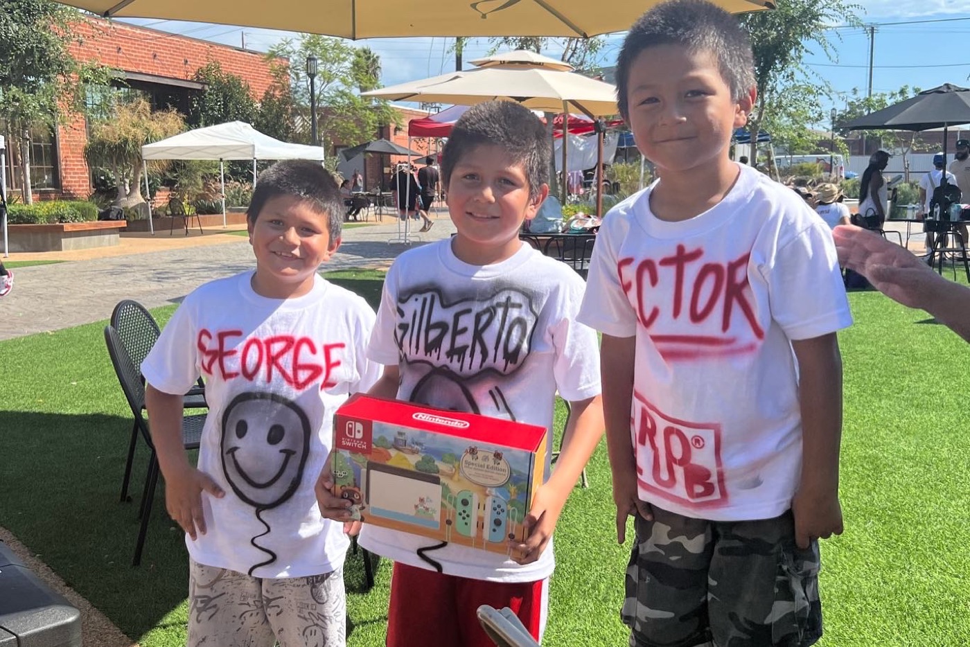 Kids at PACK Project Back 2 School Bash with a prize